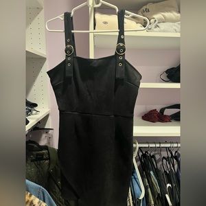 Super cute black velvet mini dress with silver buckle straps!